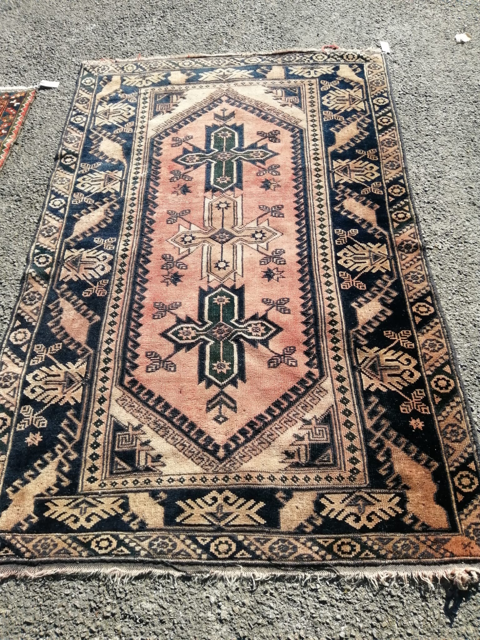 A Caucasian red ground geometric rug, 188 x 120cm